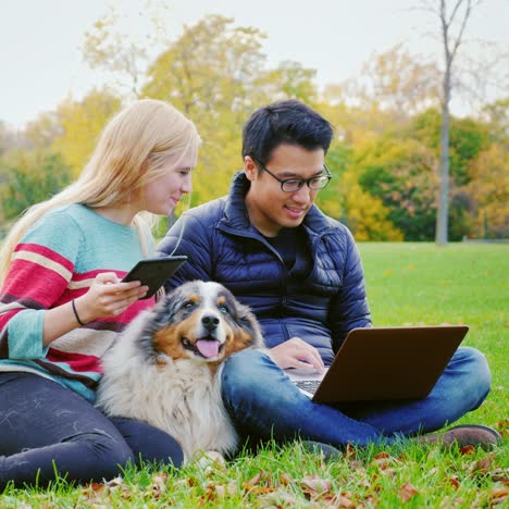 Friends-Relaxing-On-The-Lawn-In-The-Park-4