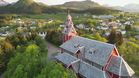 Aerial-Shot-of-Buksnes-Church,-Norway-under-Crepuscular-Sky