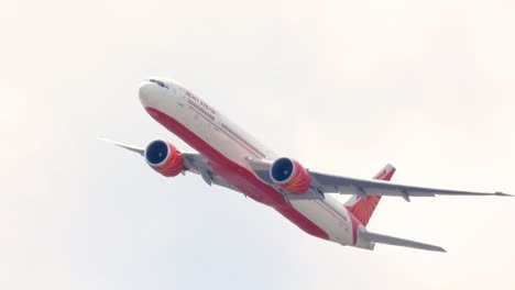 air india plane taking off from toronto airport in canada on a cloudy day.