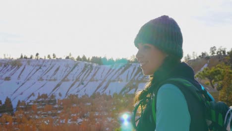 Girl-woman-hiking-with-red-rocks-formation-and-snow-near-Bryce-Canyon-in-southern-Utah-2