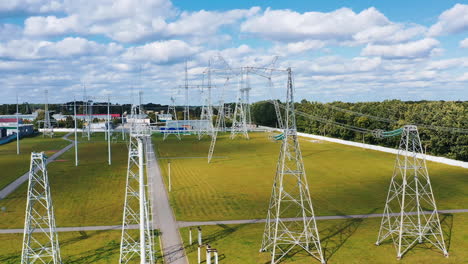 energy distribution. electricity pylons on field. electricity transportation industry in summer. energetics. power lines with wires.