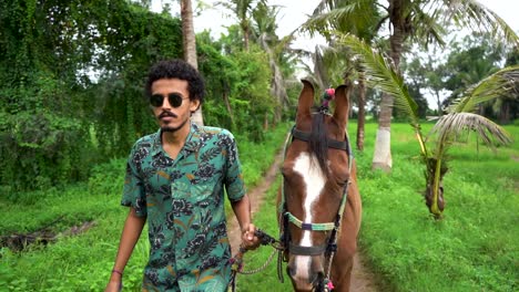 Young-handsome-man-with-brown-horse