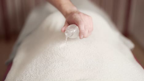 fiery-kind-of-massage,-men's-hands-set-fire-towel-on-back,-closeup-of-fire