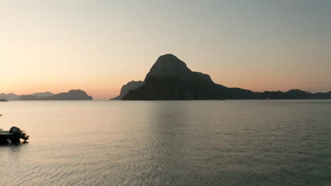 Aerial-showing-Cadlao-Island-with-sunset-and-golden-hour-in-El-Nido,-Palawan,-Philippines