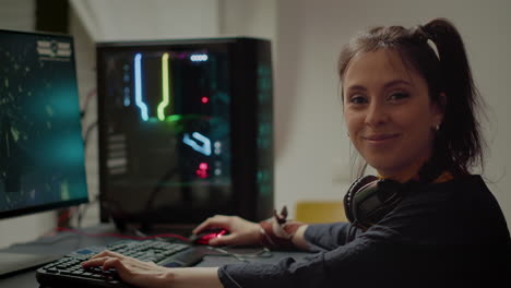 concentrated gamer looking at camera while playing space shooter video game