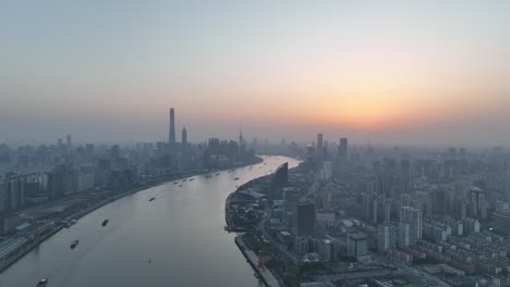 drone aerial view of sunset in huangpu river downtown shanghai china