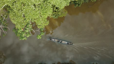 4k aerial shot of passenger boat sailing in the amazon river