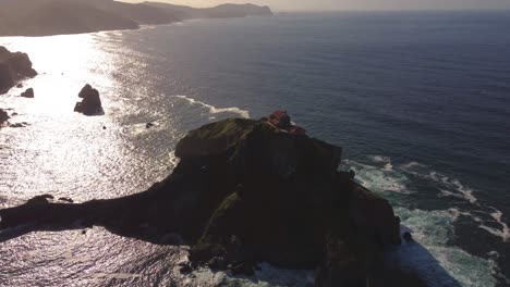 aerial footage of gaztelugatxe basque country north of spain, camino de santiago pilgrimage sunset drone scenery coastline footage