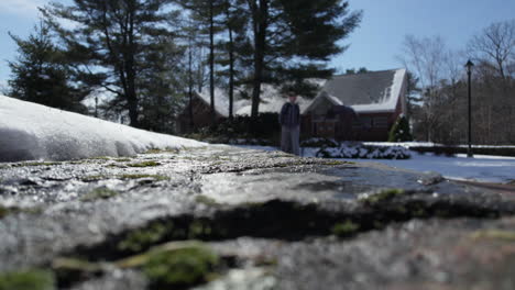 footage of the side of road during the snow season with the background of a man