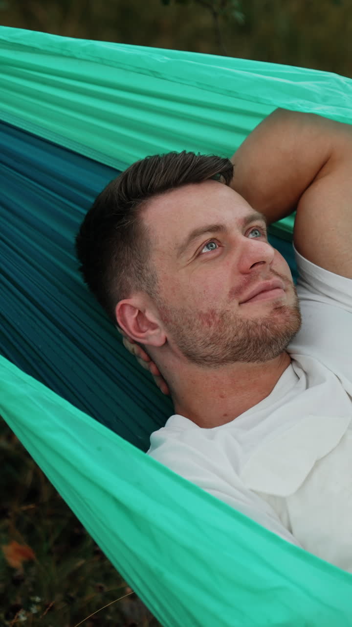 Man Relaxing in a Hammock
