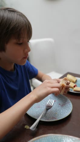 boy eating pancakes