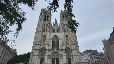 Low angle view capturing the Cathedral of St. Michael and St. Gudula in Brussels, Belgium, highlighting its gothic architecture against a cloudy sky