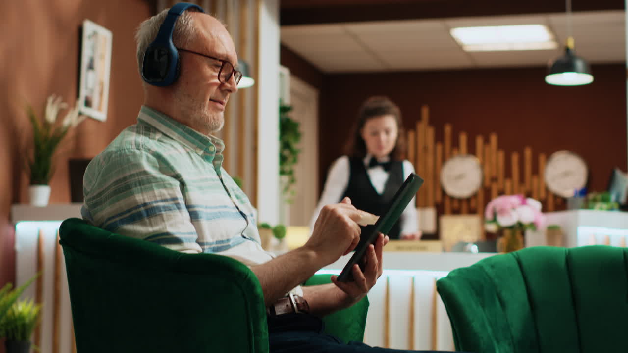 Senior adult watching movie on tablet