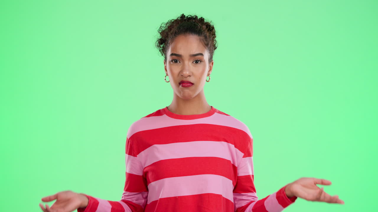 Woman shrugging with an uncertain expression