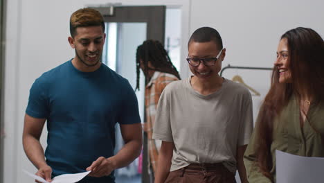 smiling colleagues in a studio