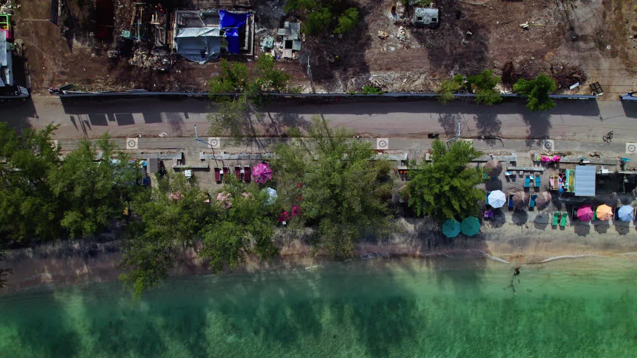 Top down aerial colour coastline sideways tracking, Gili Islands