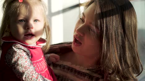 mother and daughter enjoying sunlight