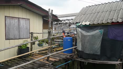 fishing village on koh panyee island, thailand, featuring wooden houses and bamboo walkways