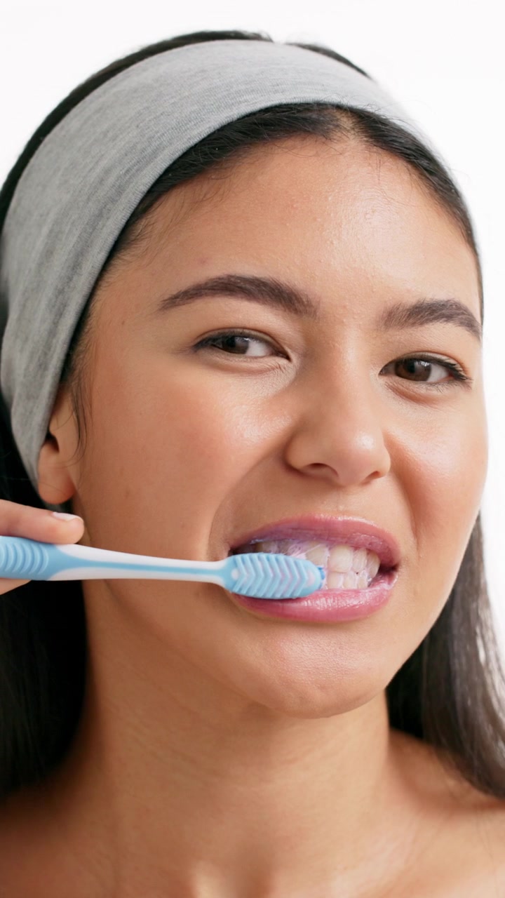 Young Woman Brushing Her Teeth in Morning Routine