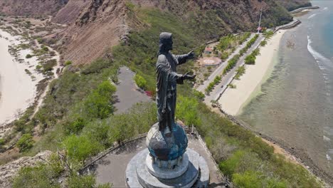 Cape-Fatucama,-Dili,-East-Timor---Christ-the-King-of-Dili-Statue---Orbit-Drone-Shot