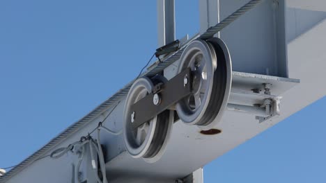 cable car roller wheels with steel rope pulley system, close up shot