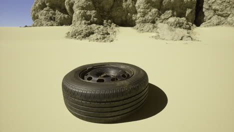 rustic tire rests in desert landscape near rocky formations
