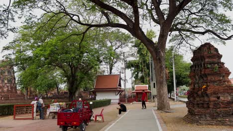 tourists exploring ancient temple and pagoda