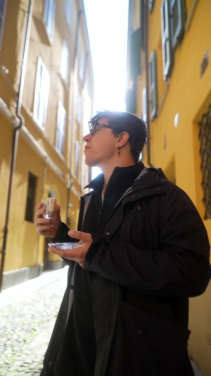 Man Drinking Coffee in a Narrow Alley