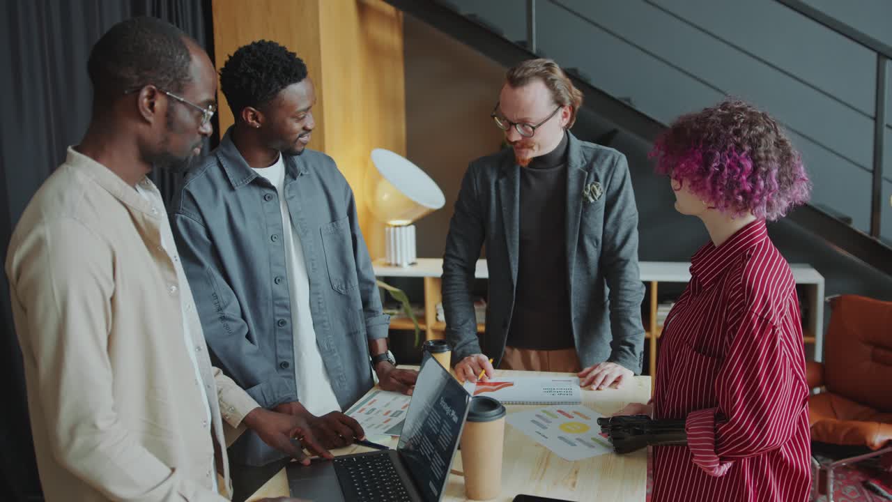 Business Team Leader Holding Meeting with Diverse Colleagues in Office