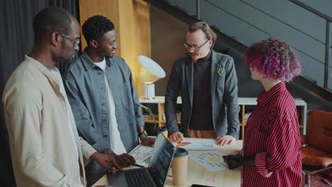 business team leader holding meeting with diverse colleagues in office