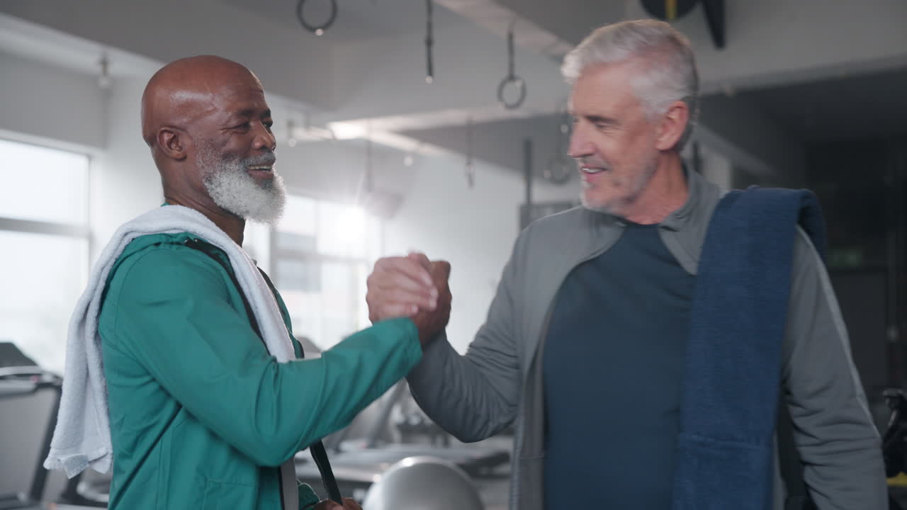 Two senior men meeting at the gym