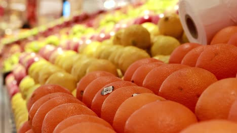 rows of colorful fruits neatly arranged under bright lighting in a gold coast supermarket, showcasing a vibrant and fresh atmosphere