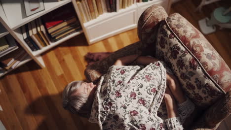 woman relaxing in armchair