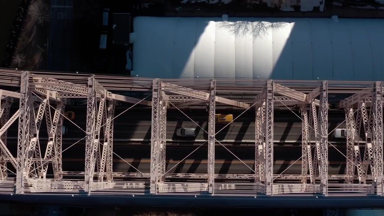 View of New York City from above showing a bridge and traffic below