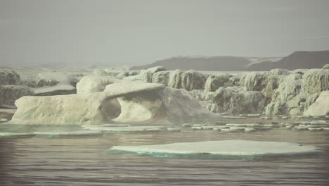 gigantic ice block structures on the black sand by the sea shore