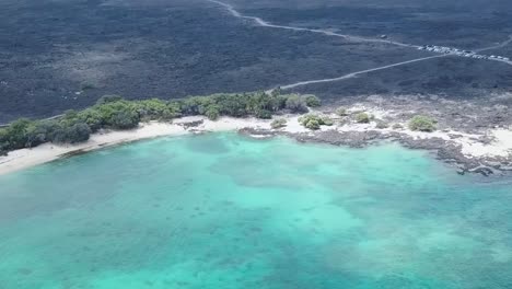 drone aerial black sand blue water hawaii