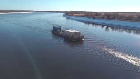 barge on a river in winter