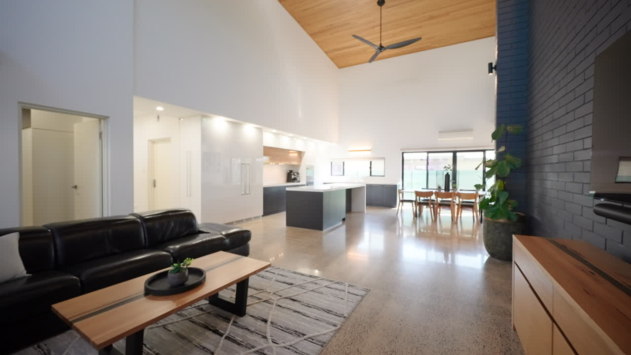 Open plan modern architecture living room with wooden ceiling and luxurious kitchen