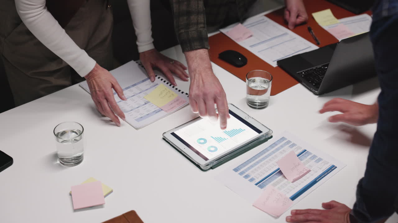 Business meeting with data analysis and planning