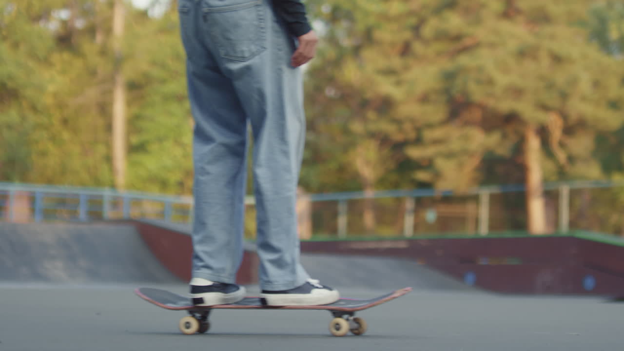 Unrecognizable Teenager Skating Past Camera