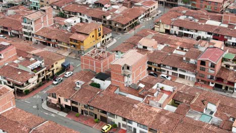 Top-down-aerial-over-Favelas-in-metropolis-city-Medellin,-Colombia,-poverty