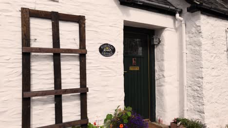 cottage entrance with vibrant flower garden