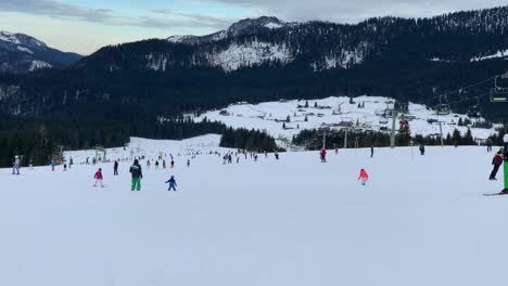 people skiing down a ski run in winter in bavaria, germany