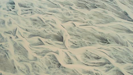 aerial view of winding glacier river formations in iceland.
