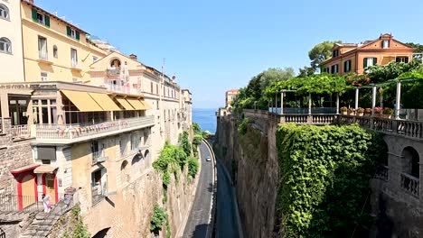 a picturesque street with buildings and greenery