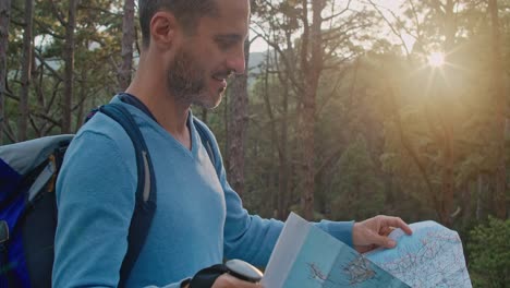 male traveler reading map