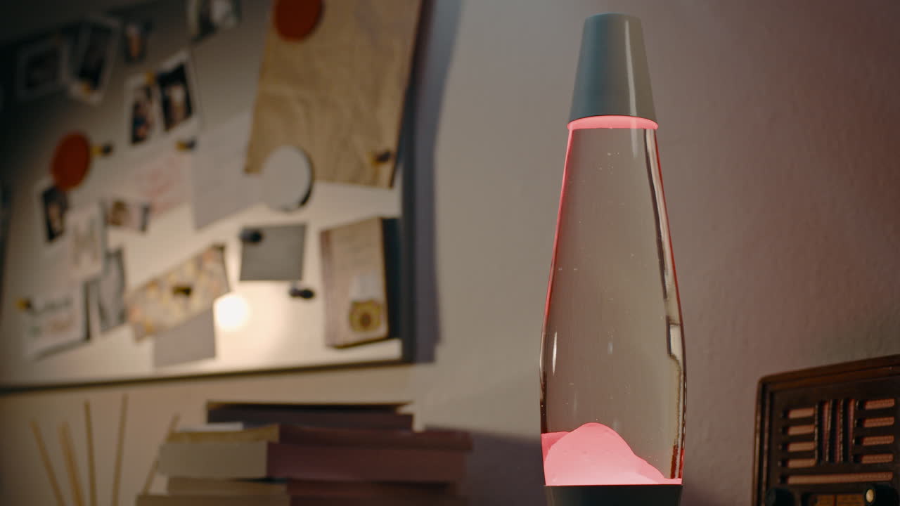 Timelapse of Hot Red Lava Lamp with Vibrant Moving Fluid on Office Desk at Night