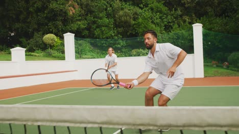 tennis players playing a point