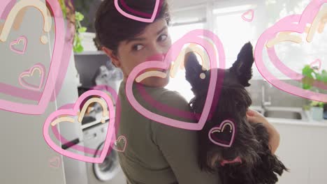 animación de corazones sobre mujer caucásica con su perro mascota.