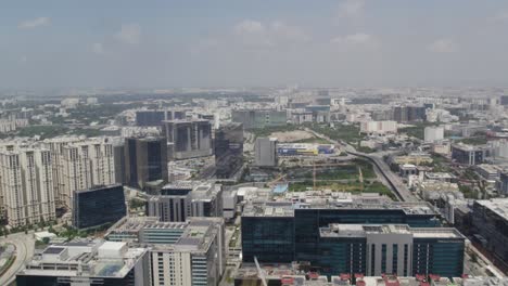 aerial video a well-developed city with skyscrapers, major thoroughfares, and bridges is seen in a cinematic film